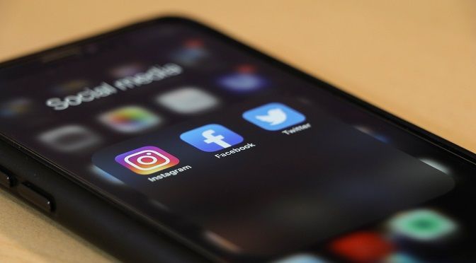 showing social media icon on mobile screen